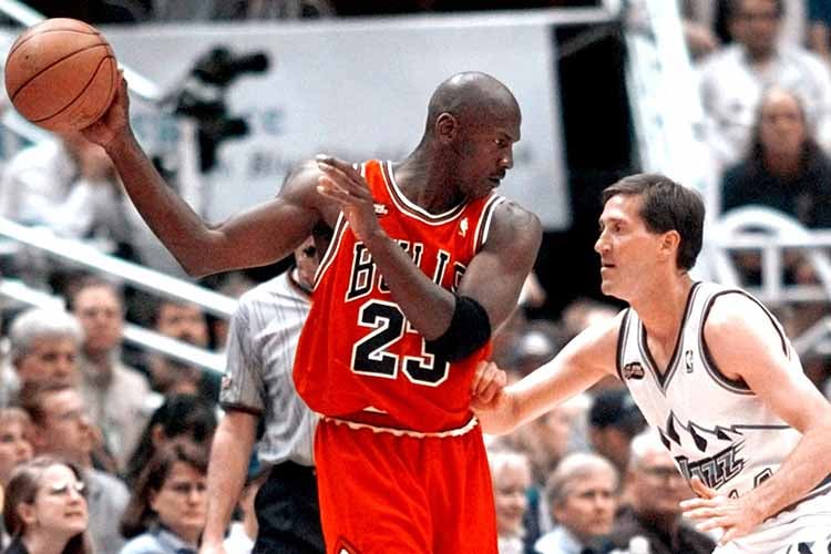 Michael Jordan posts up Jazz guard Jeff Hornacek in the 1998 NBA Finals
